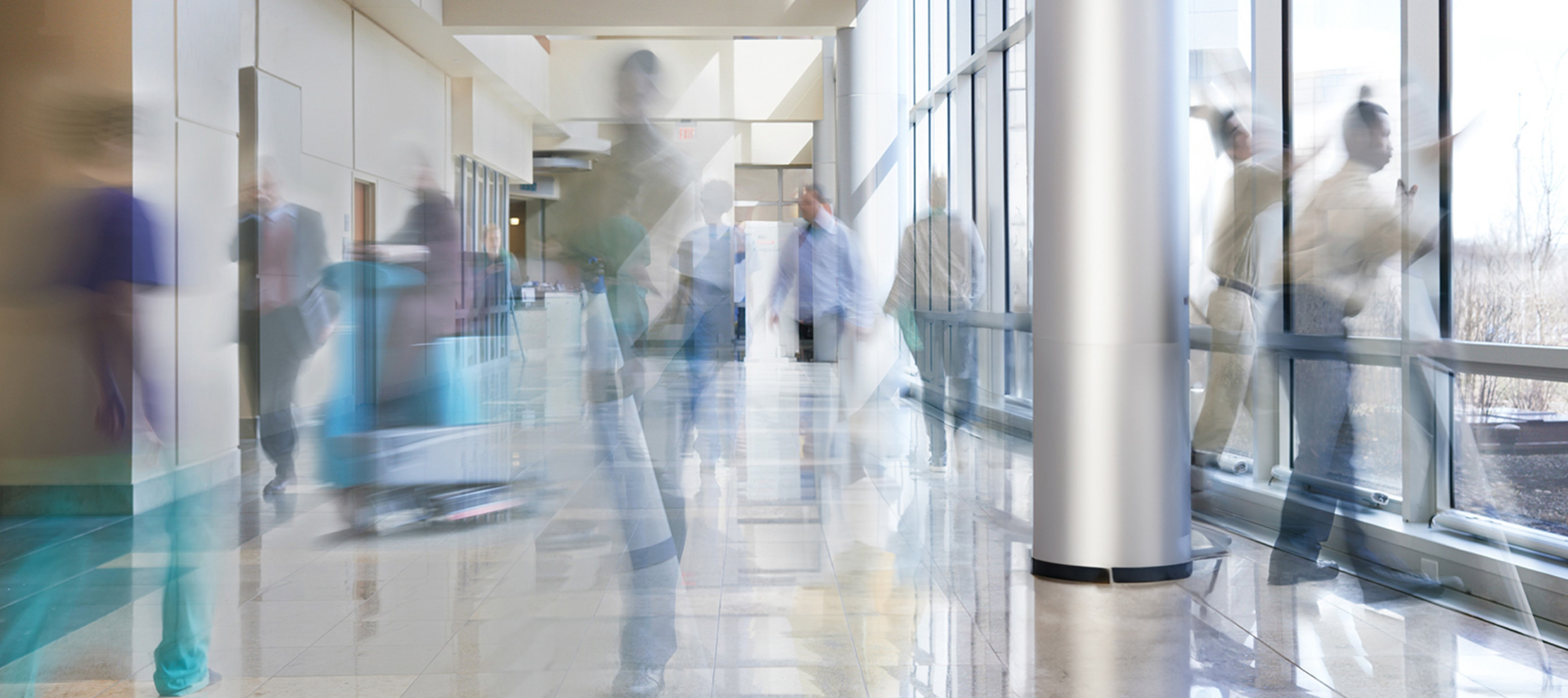 Healthcare hallway and people walking